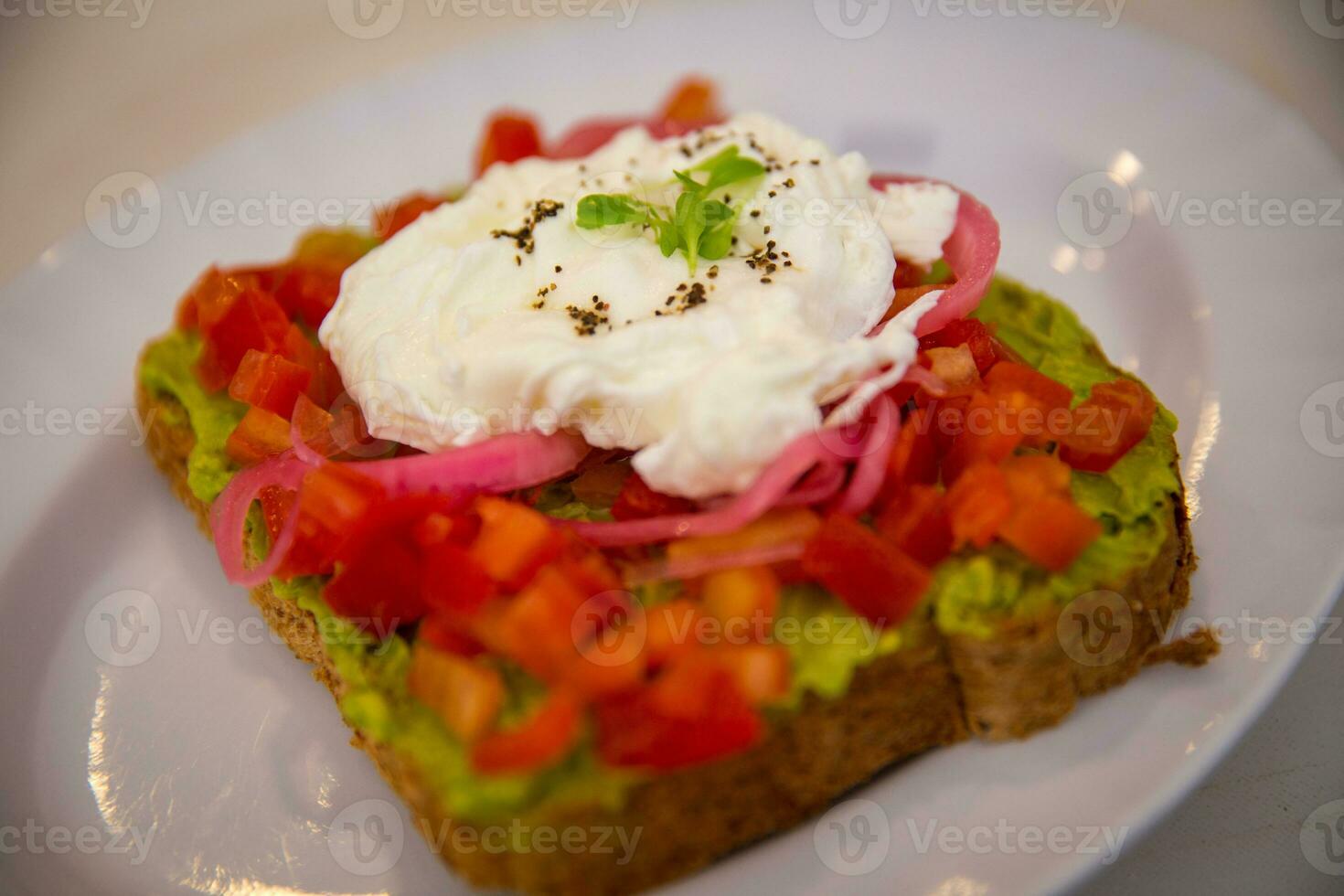 Avocado toast with a poached egg photo