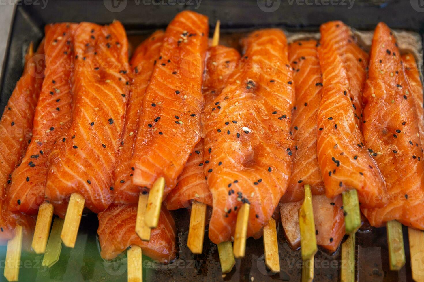 Marinated Salmon on a stick photo