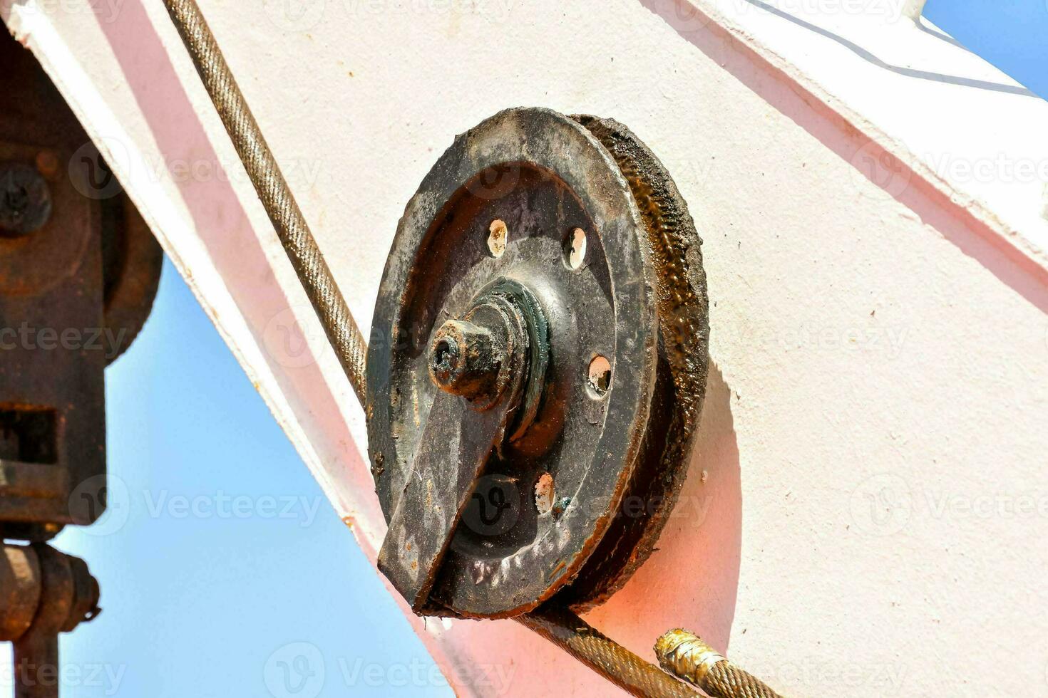 a close up of a large metal wheel on a ship photo