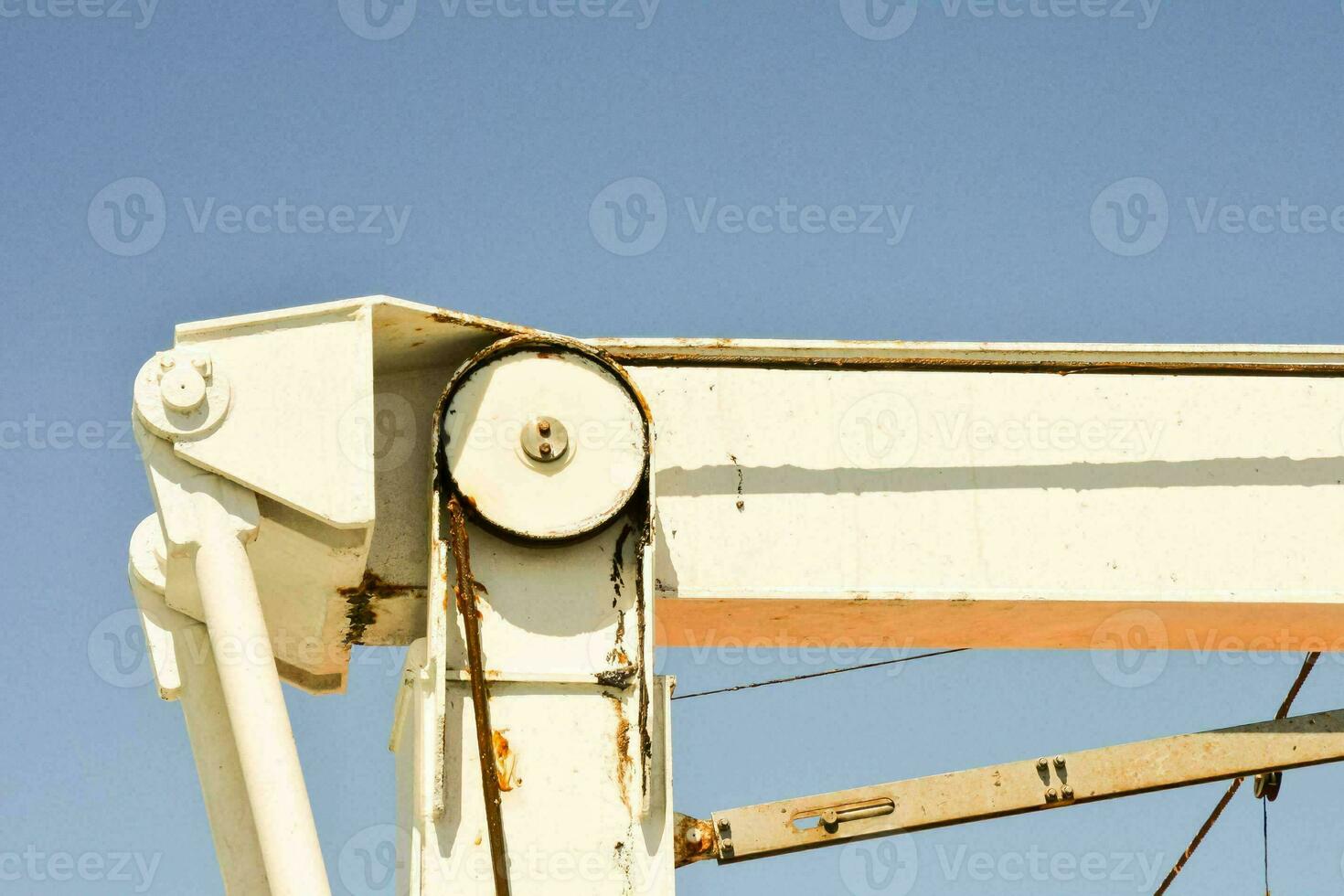 a close up of a metal structure with a blue sky photo