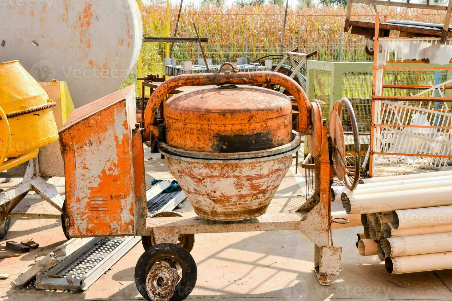 an old cement mixer sitting on a cart photo
