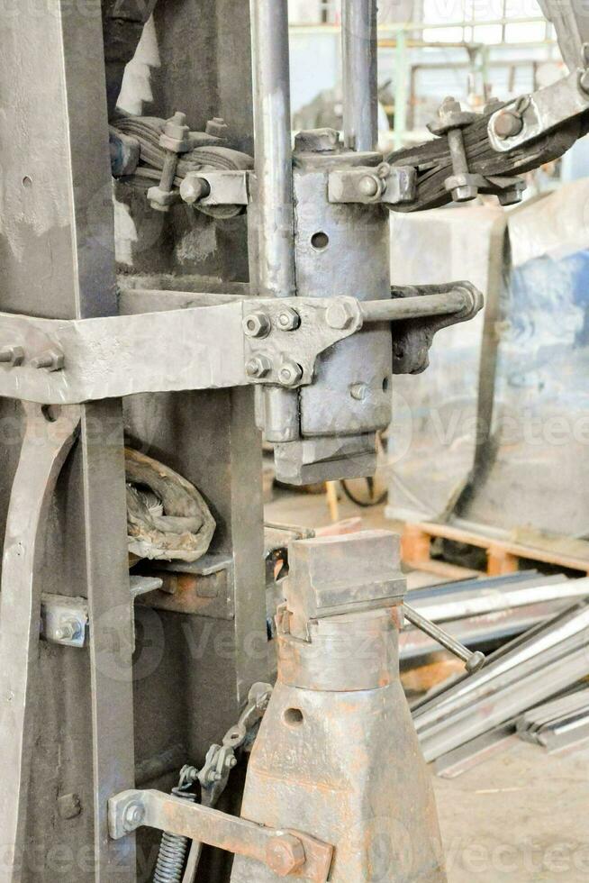 a machine that is being used to make metal parts photo