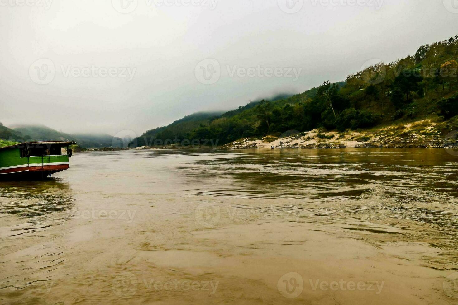 a boat on the river in a muddy area photo