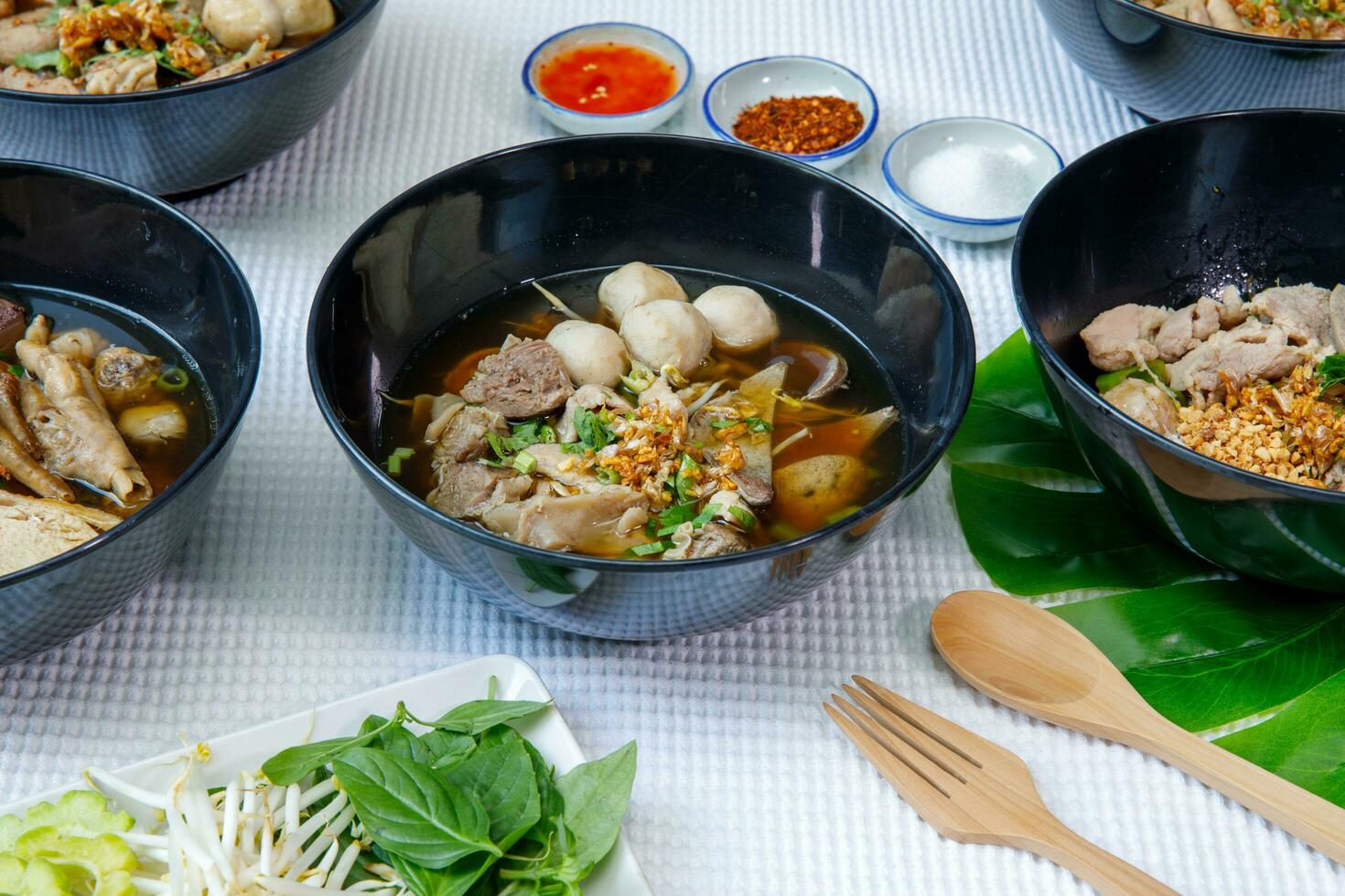 Braised pork and pork ball with noodles soup in bowl, Chinese-Thai food. photo