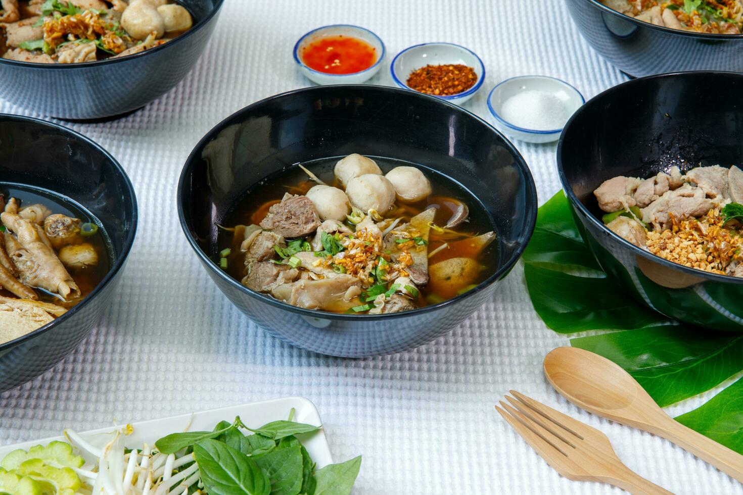 Braised pork and pork ball with noodles soup in bowl, Chinese-Thai food. photo