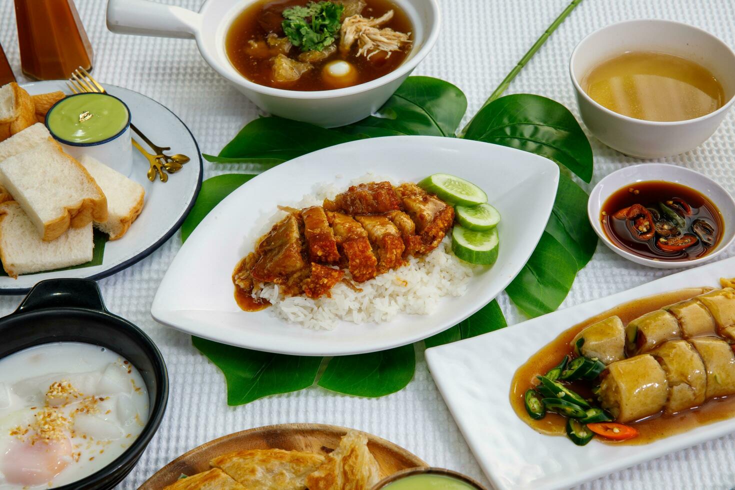 crispy pork with rice,  or rice topped with crispy pork and sauce photo