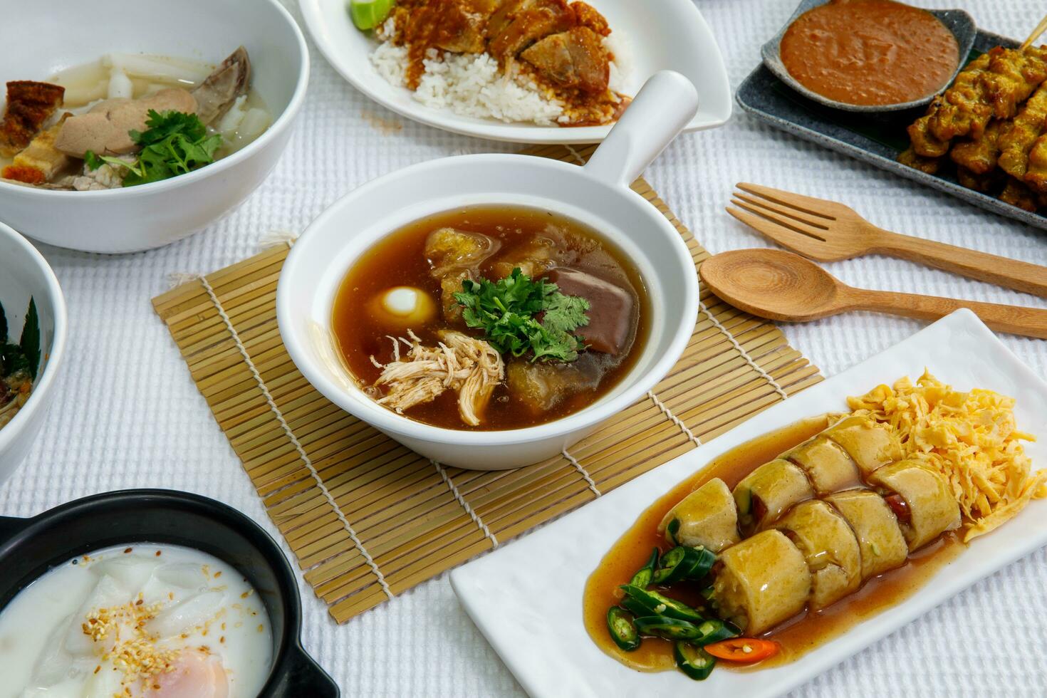 Fish maw soup , mushroom and bamboo shoot served in clay pot - Thai food called Kra Praw Pla photo