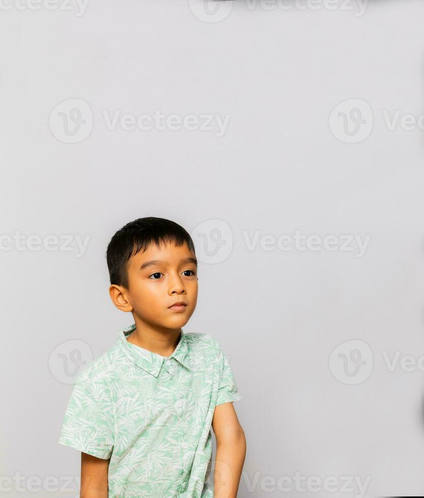 Cute little boy in casual outfit on background photo