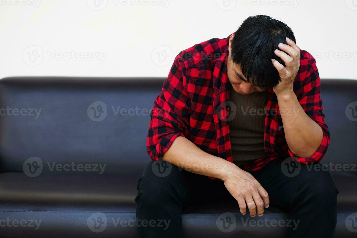 Asian man feels sad, stressed, depressed, hand covered his head. Concept, drepression, failure, disappointment, broken heart. guilty, have life problems. Major Depressive Disorder photo