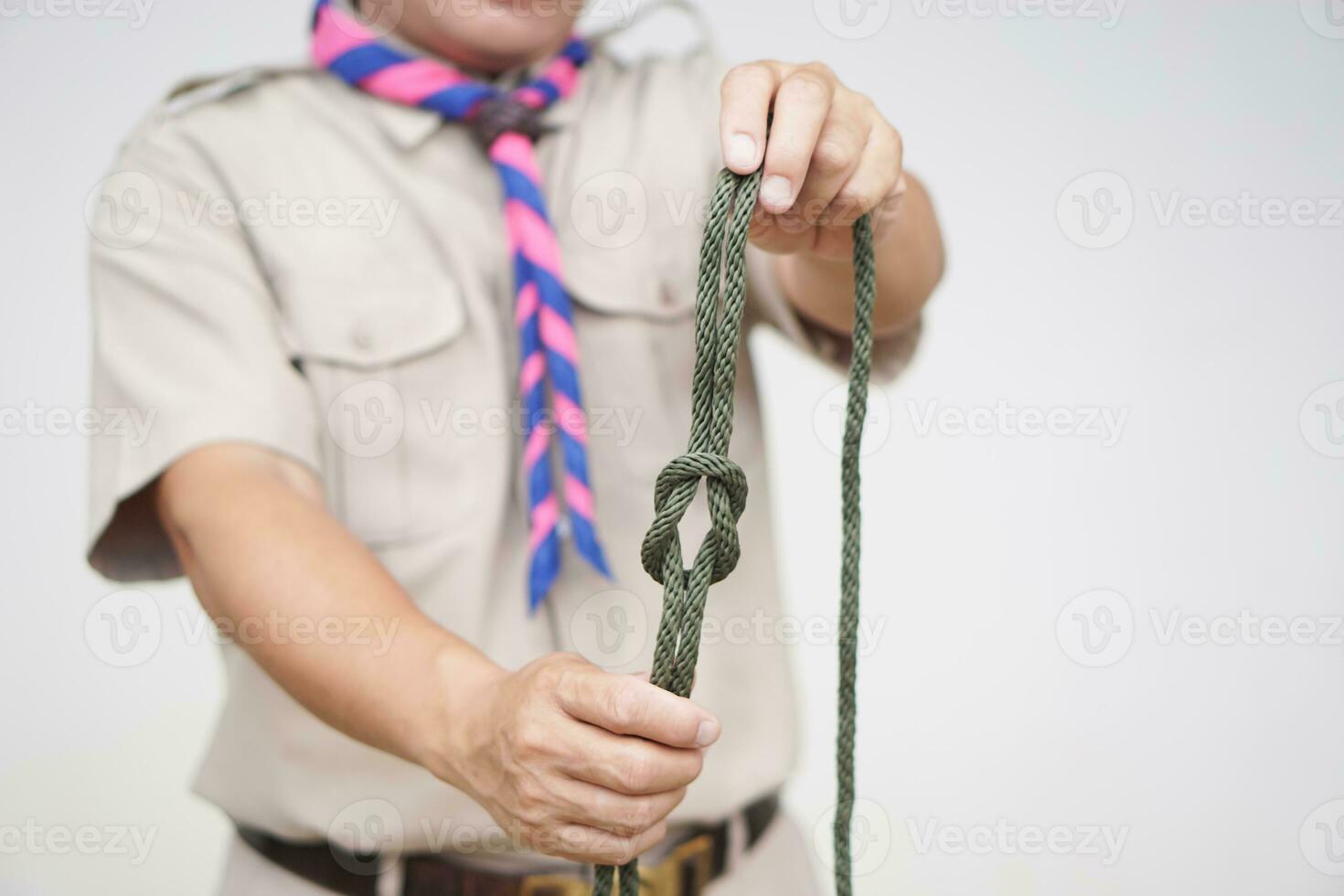 https://static.vecteezy.com/system/resources/previews/031/216/103/non_2x/tying-rope-knot-pattern-demonstrated-by-scout-teacher-trainer-concept-useful-tying-knot-for-many-purposes-in-daily-life-tying-knot-rope-teaching-aid-life-skills-with-rope-photo.JPG