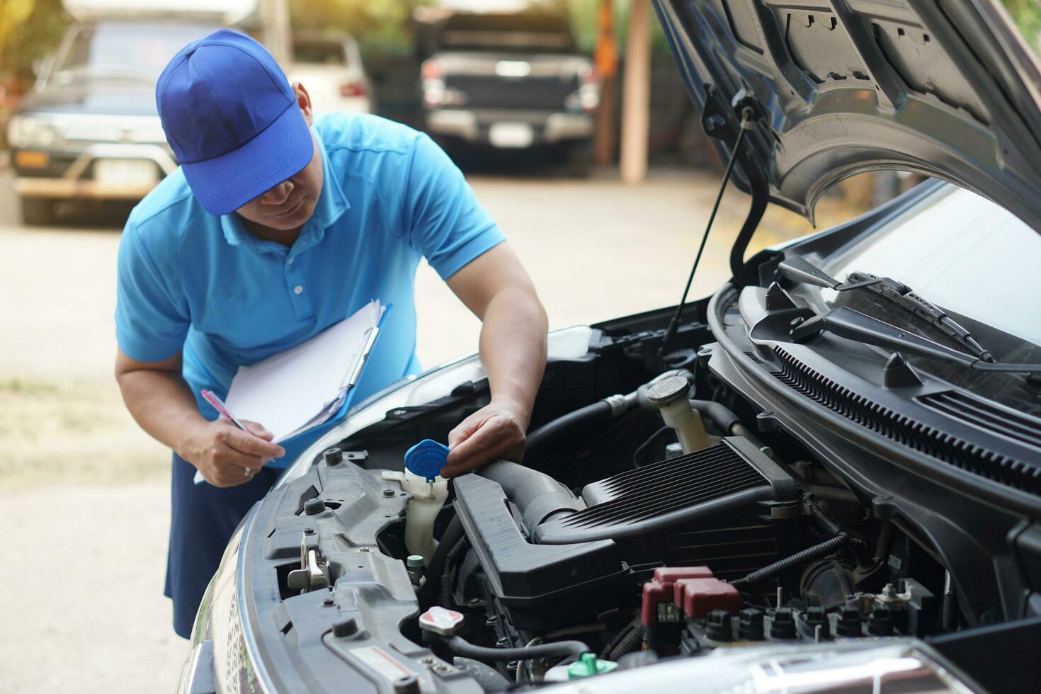 A man is working on a car's engine. Diagnosis auto repair workshop. -  PICRYL - Public Domain Media Search Engine Public Domain Search