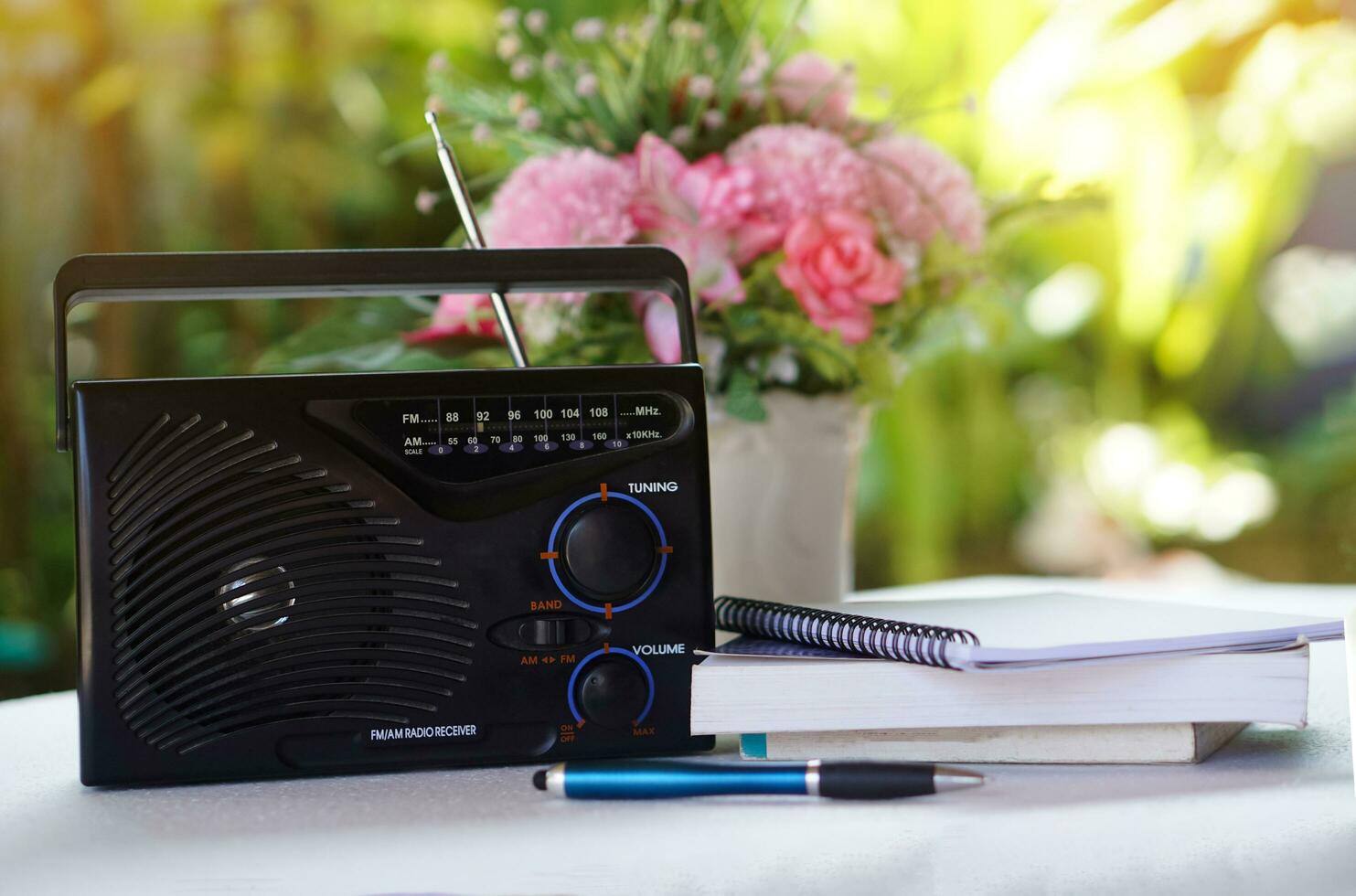 Vintage old transistor radio, placed outdoor. Concept , Analog technology for communication, entertainment, news, songs, music and advertisment photo