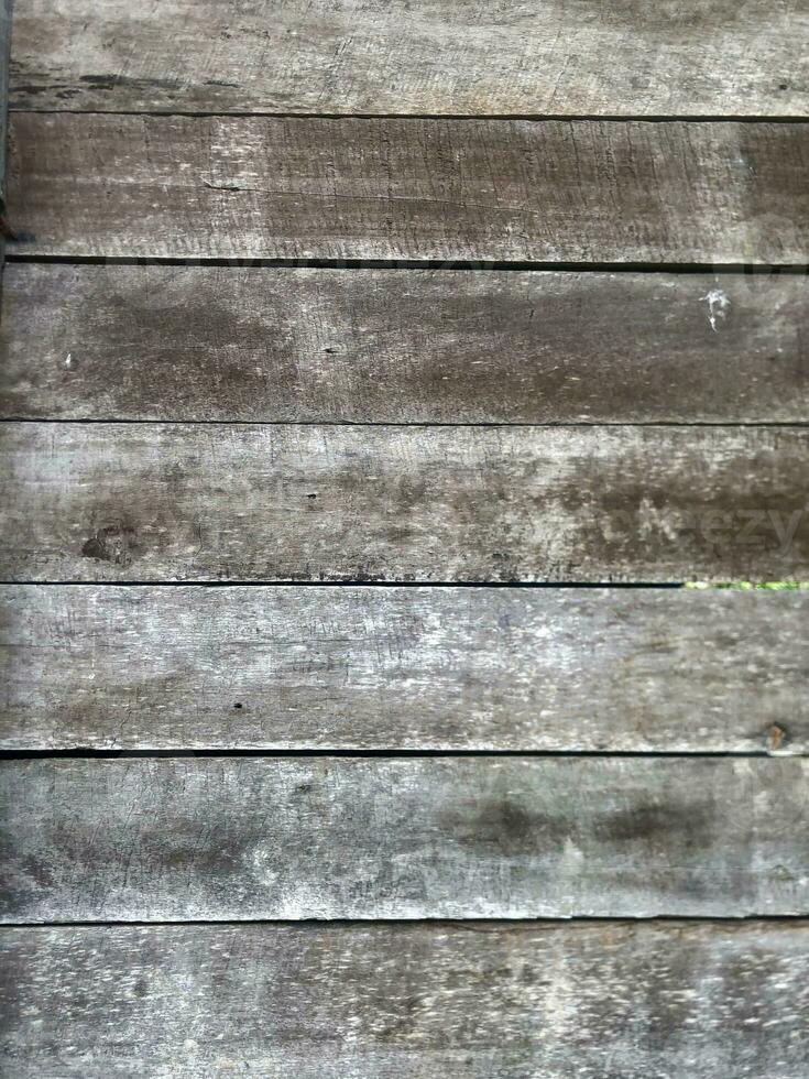 a close up of a wooden wall with some paint photo