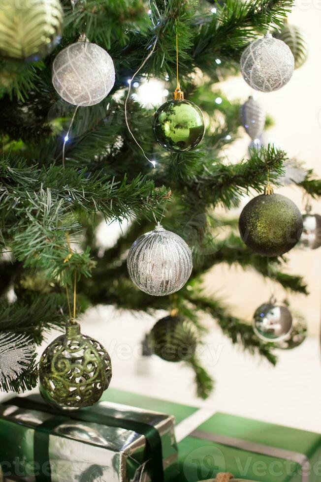 Christmas golden balls hanging on the Christmas tree photo