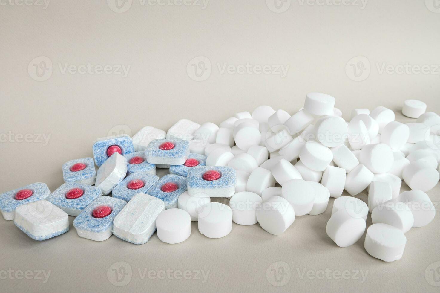 Chemical tablets for the dishwasher. Colored capsules are dishwasher safe. photo