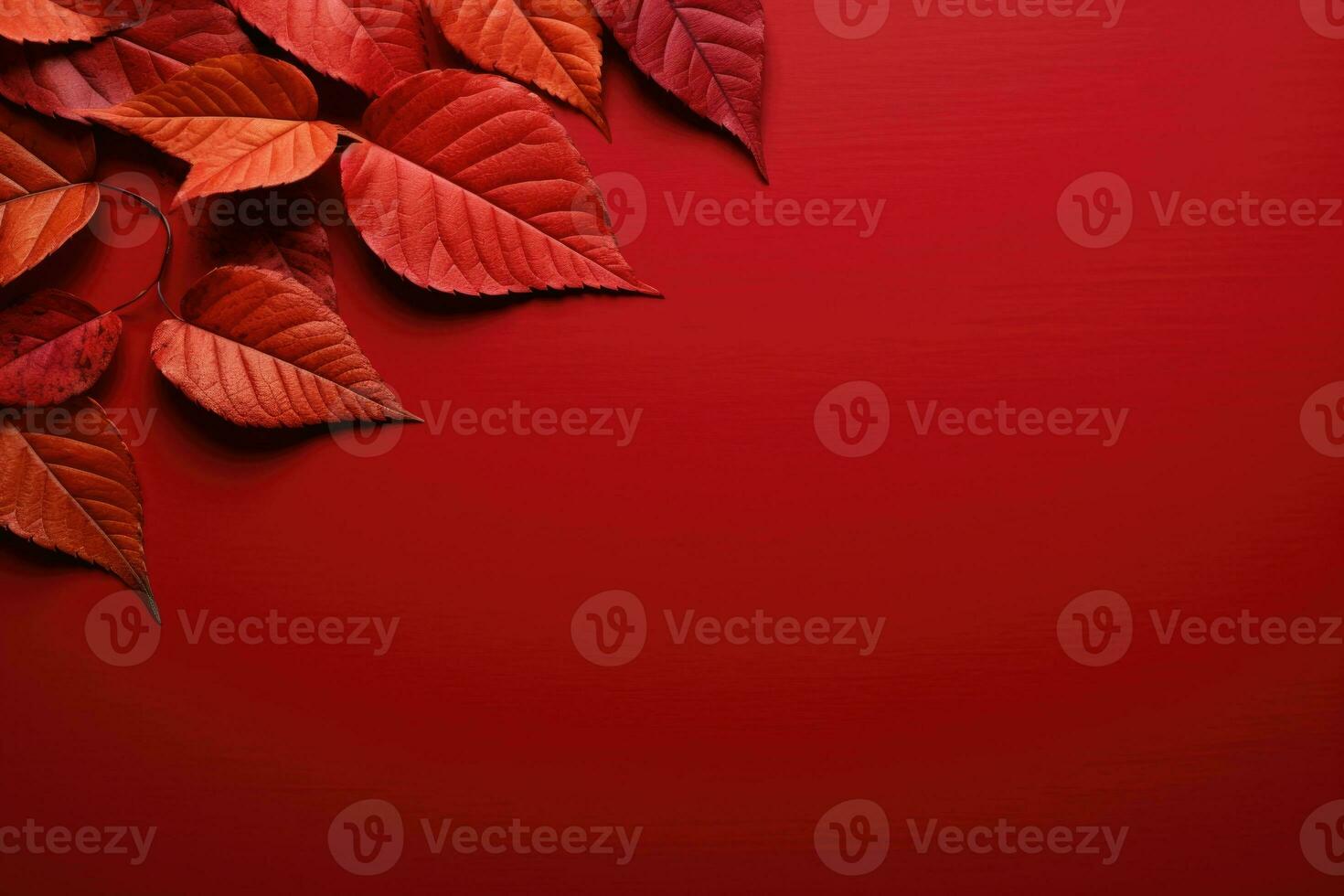 Autumn leaves on a red table, a place for text. AI generated photo
