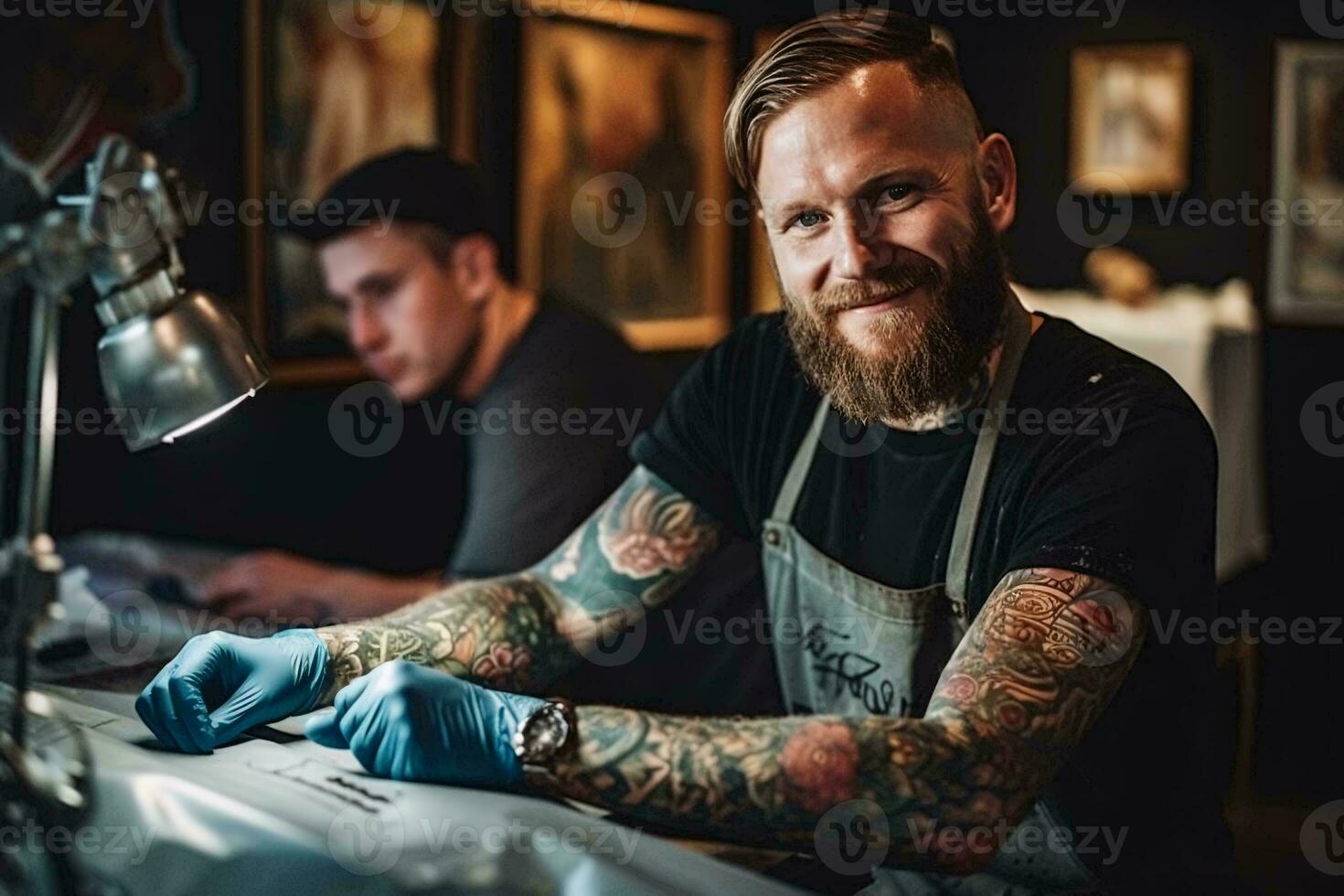 Photo of a bearded man with tattoos sitting at a table AI Generated