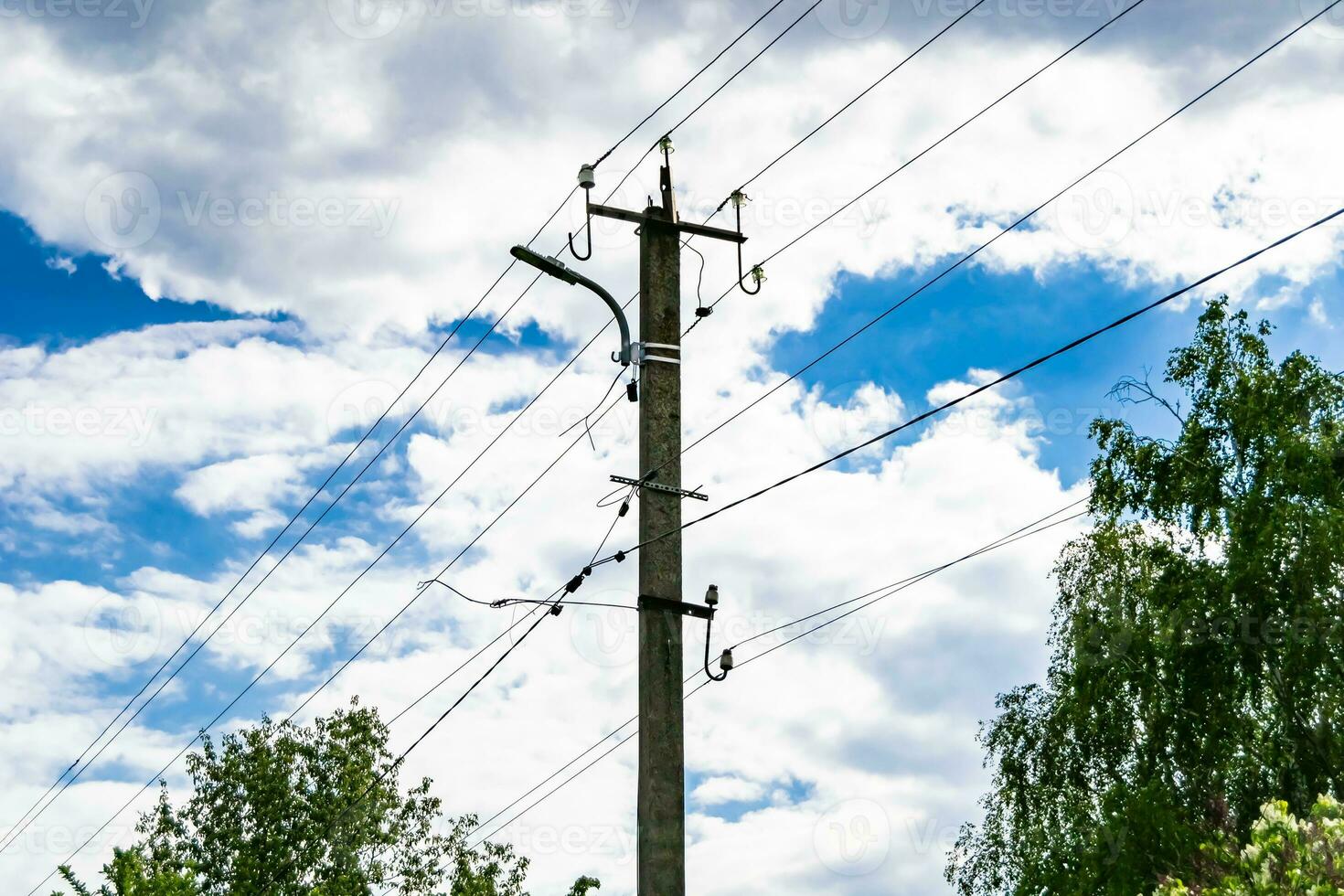 Power electric pole with line wire on colored background close up photo