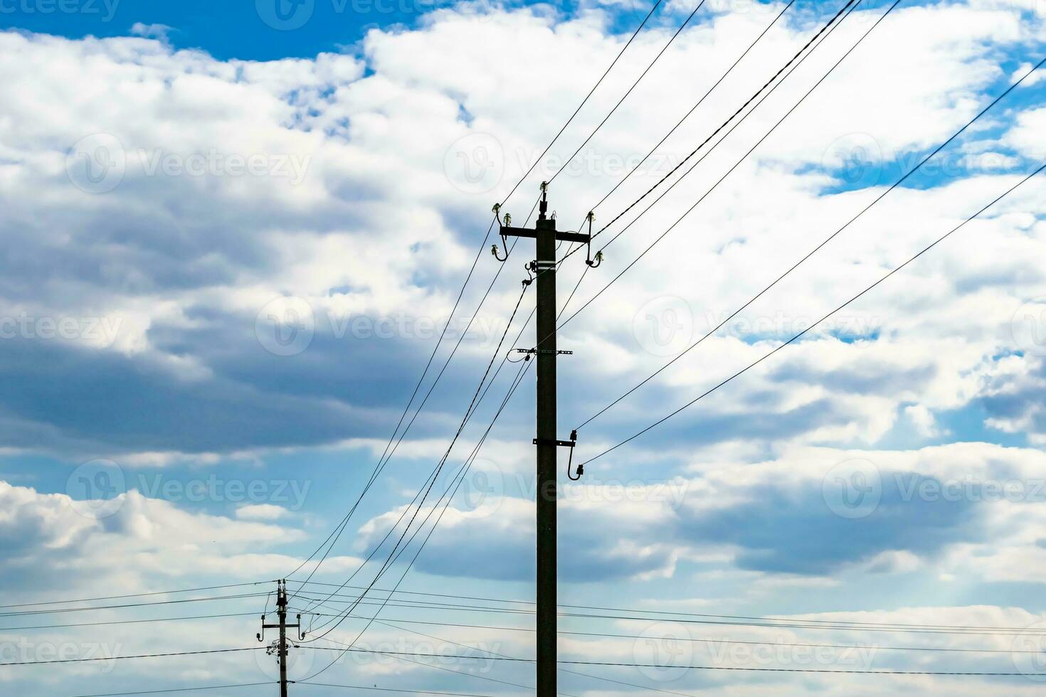 Power electric pole with line wire on colored background close up photo