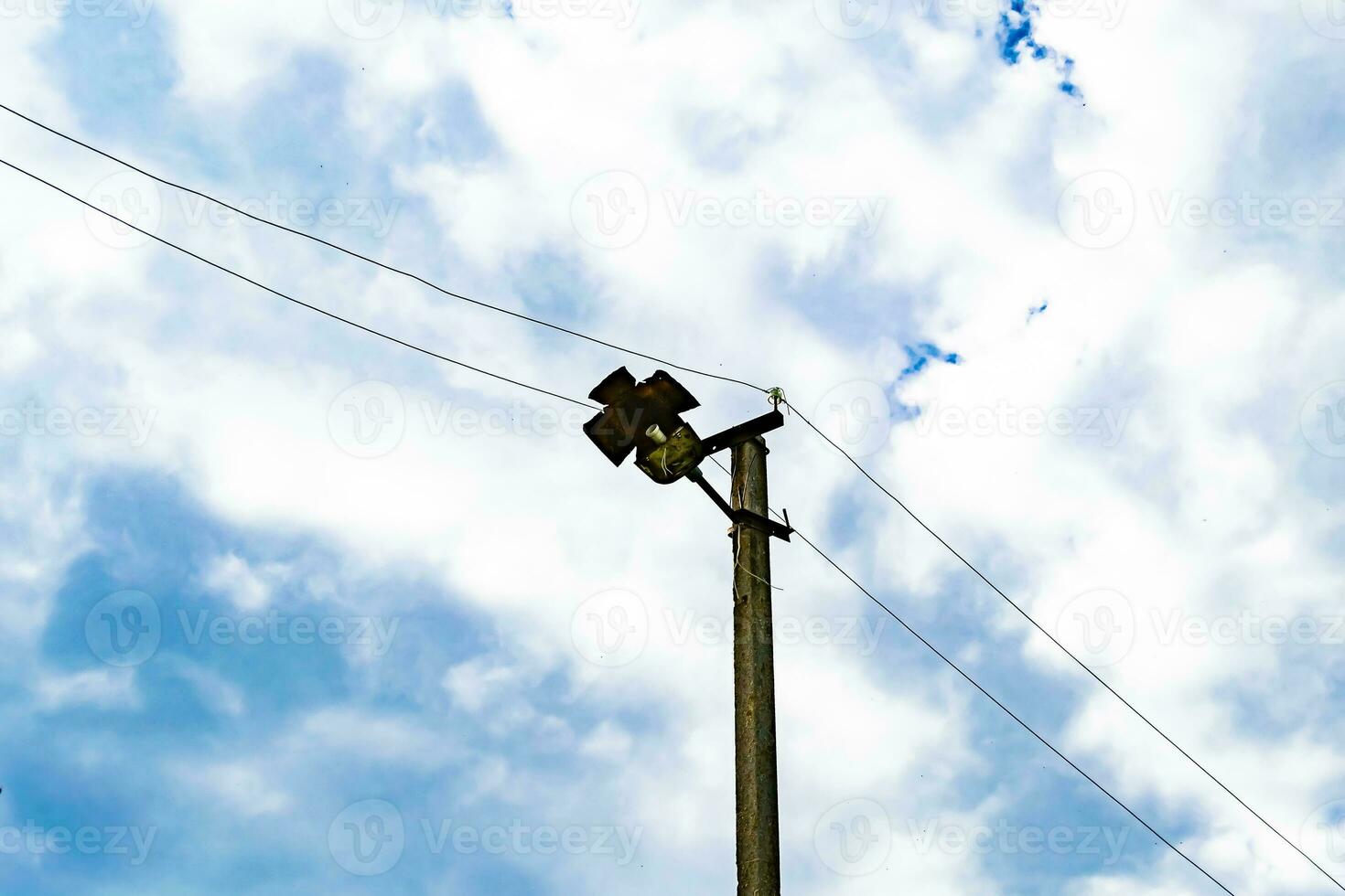 Power electric pole with line wire on colored background close up photo