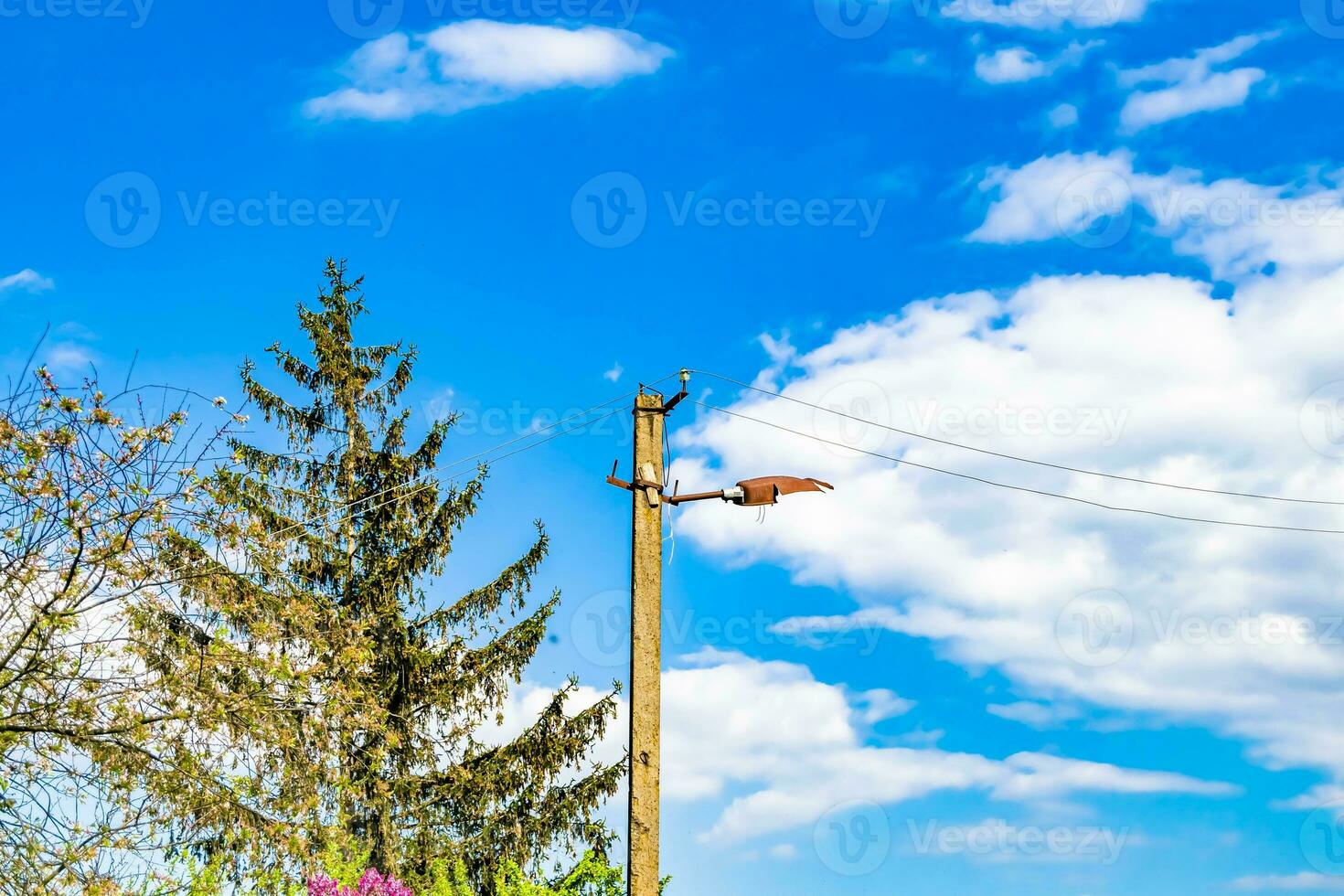 Power electric pole with line wire on colored background close up photo