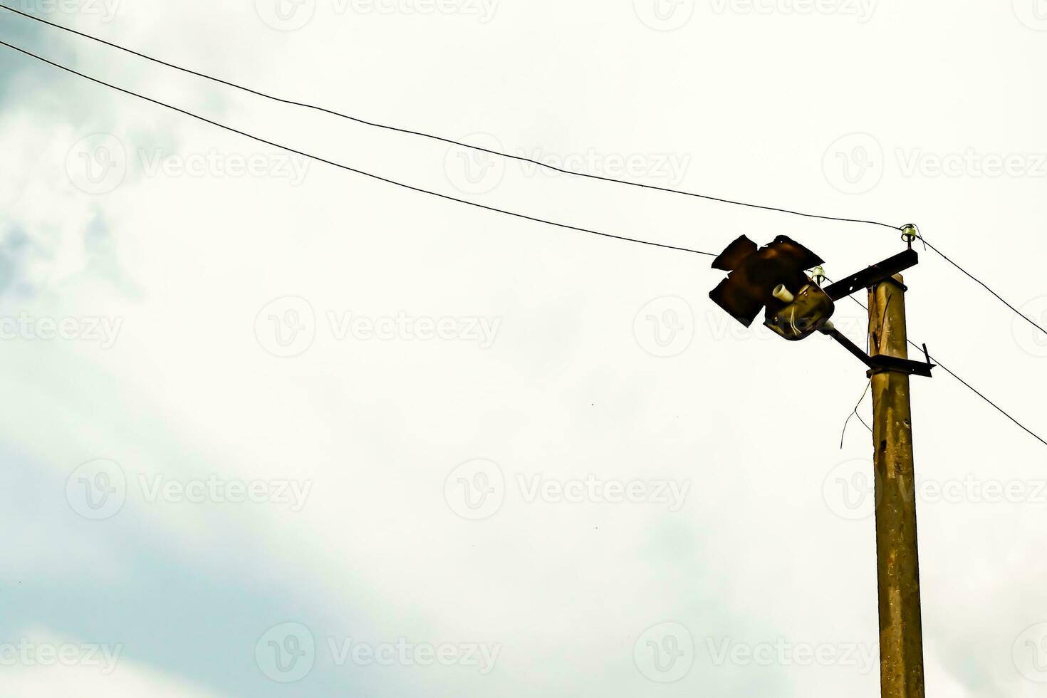 Power electric pole with line wire on colored background close up photo