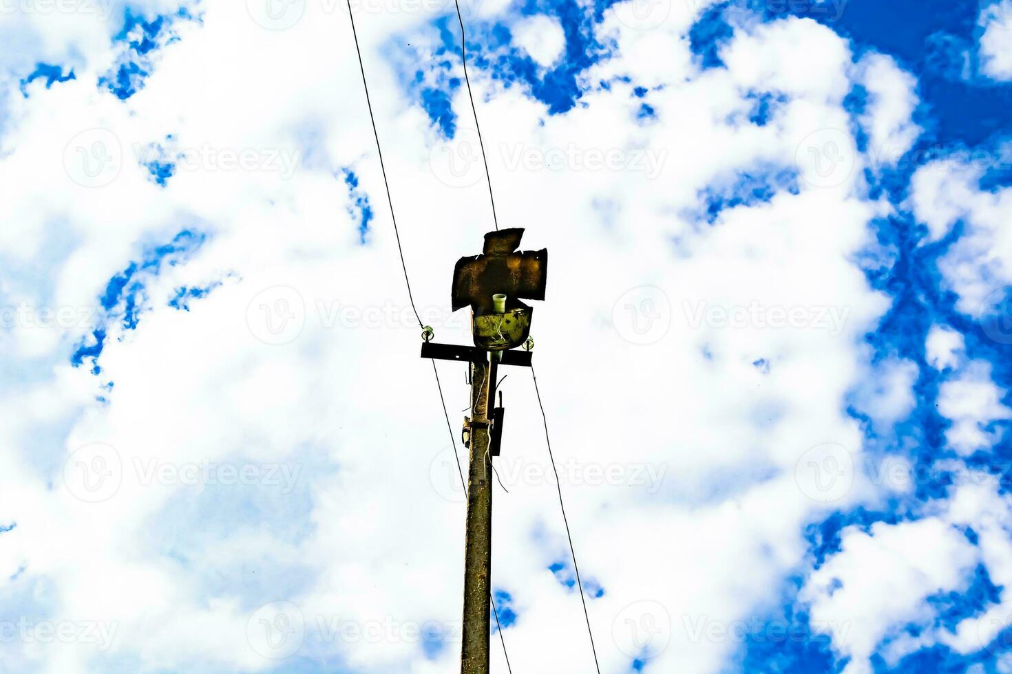 Power electric pole with line wire on colored background close up photo