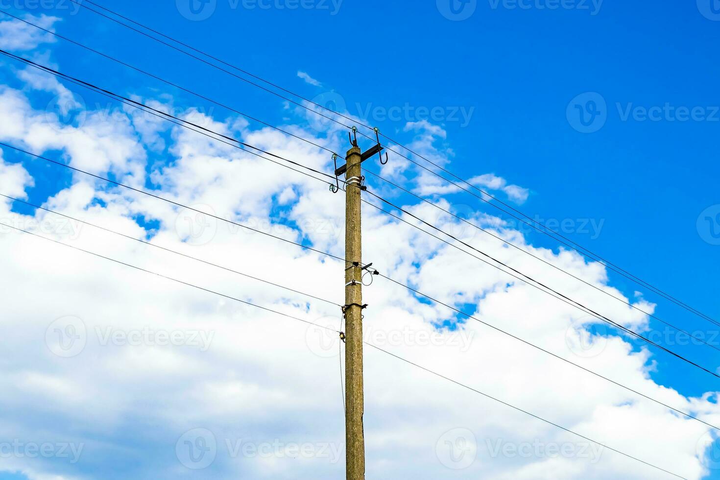 Power electric pole with line wire on colored background close up photo