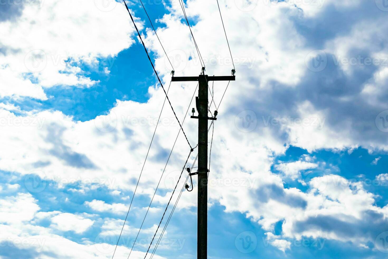 Power electric pole with line wire on colored background close up photo