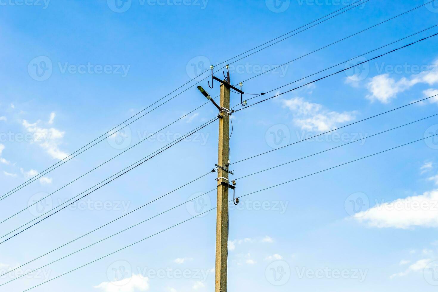 Power electric pole with line wire on colored background close up photo