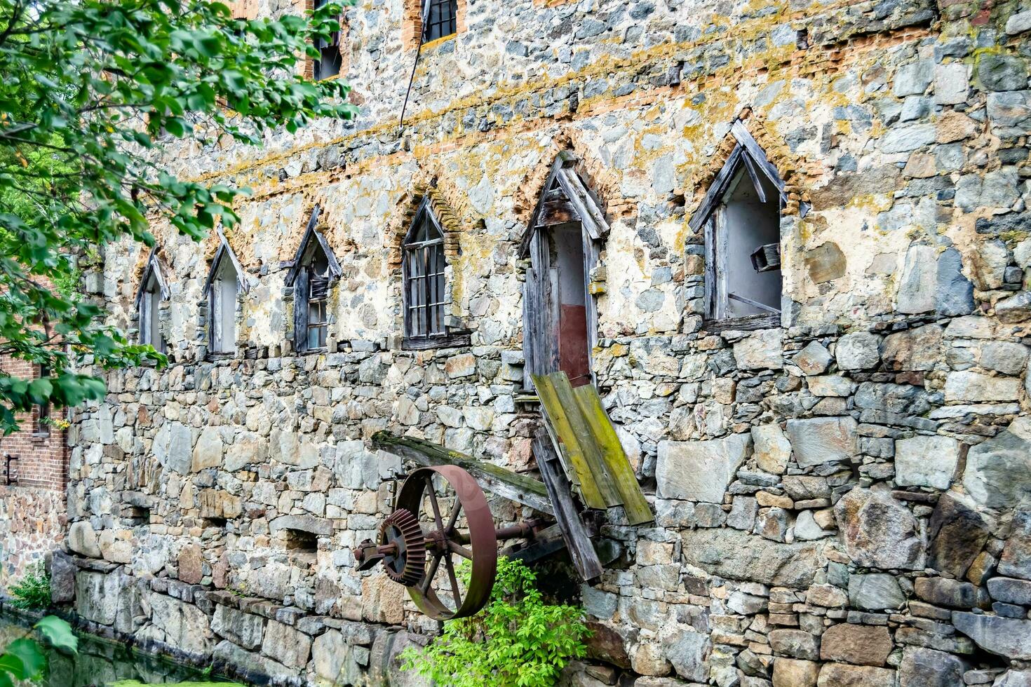 Photography on theme outstanding building beautiful brick old water mill photo