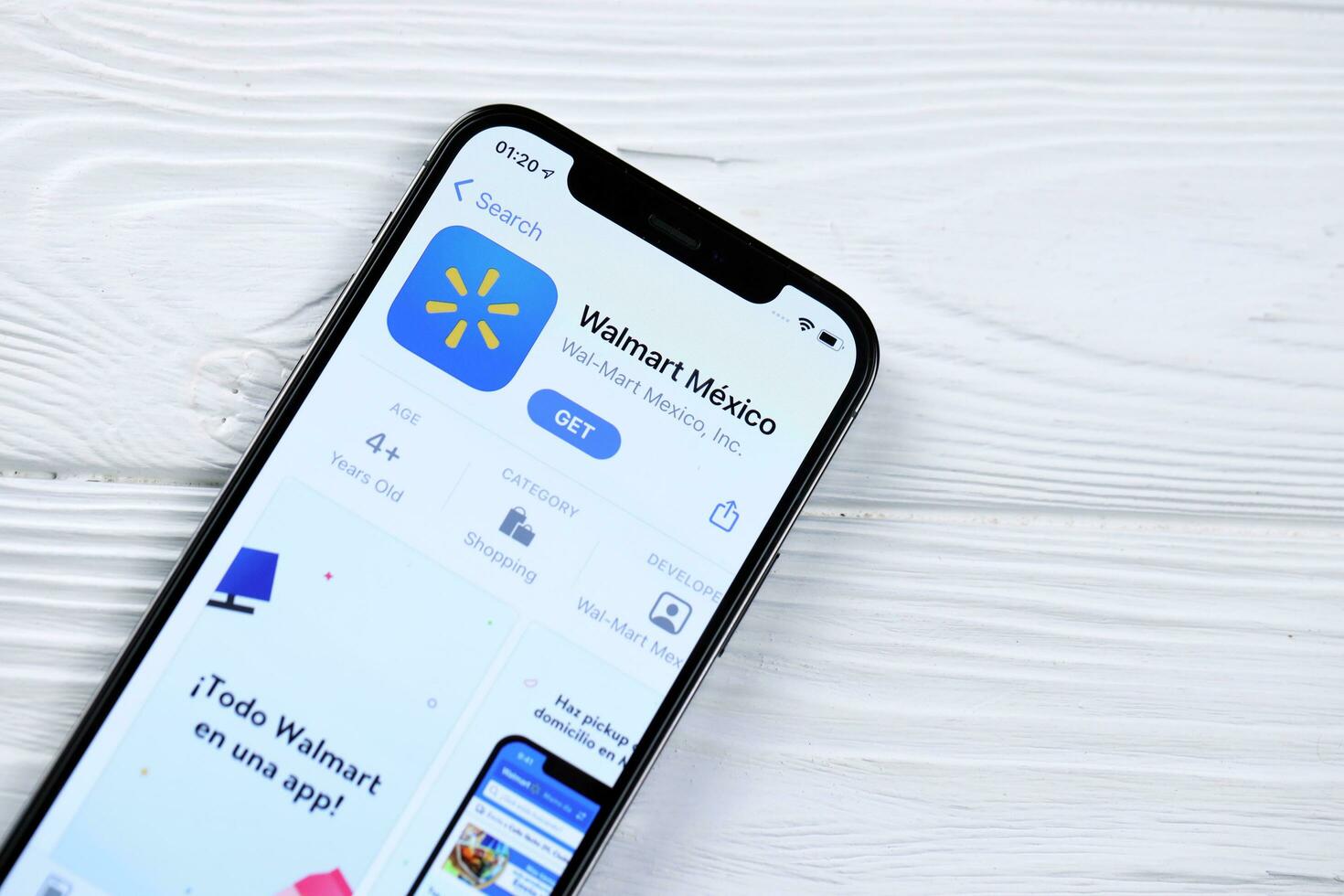 KHARKOV, UKRAINE - MARCH 5, 2021 Walmart icon and application from App store on iPhone 12 pro display screen on white table photo