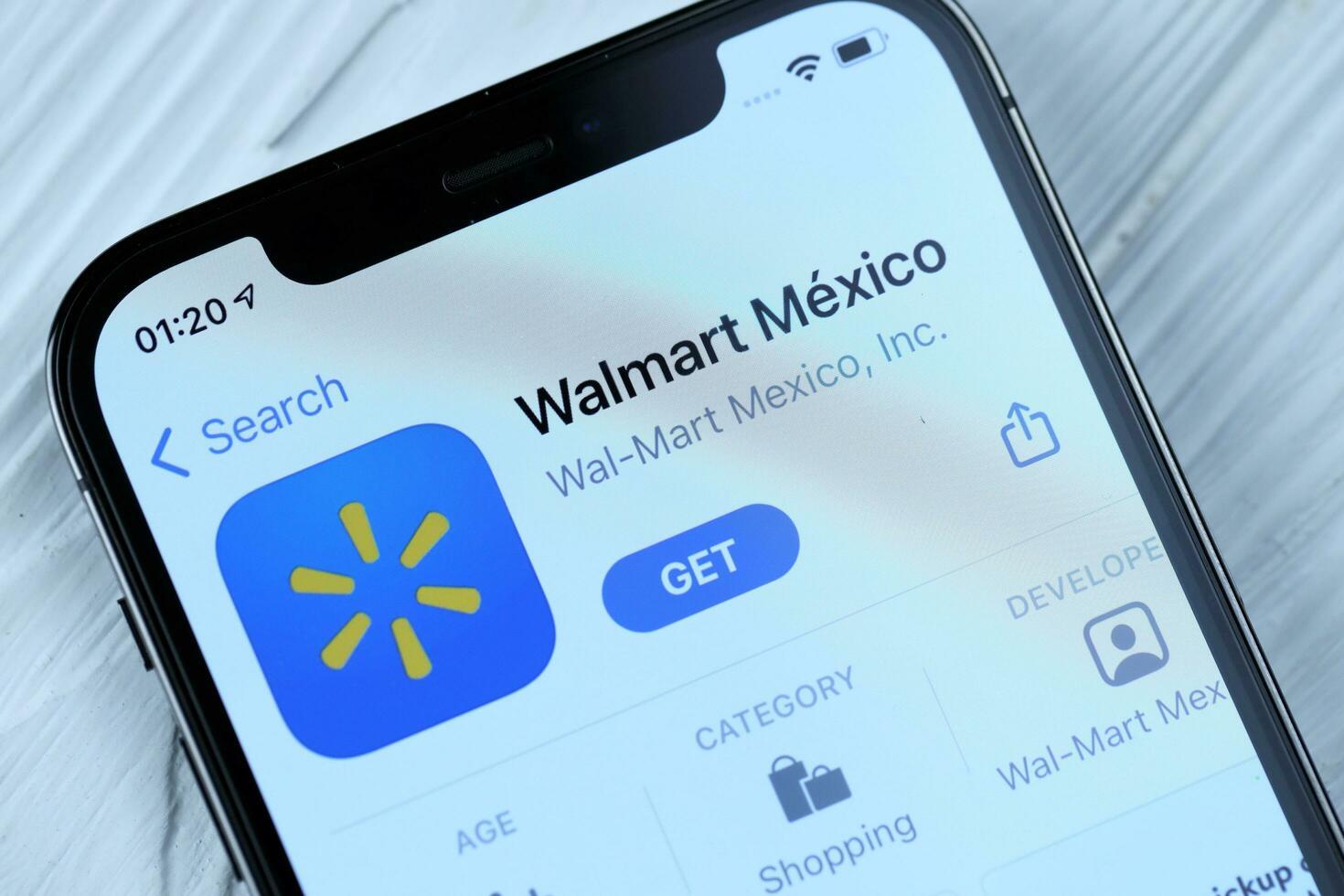 KHARKOV, UKRAINE - MARCH 5, 2021 Walmart icon and application from App store on iPhone 12 pro display screen on white table photo