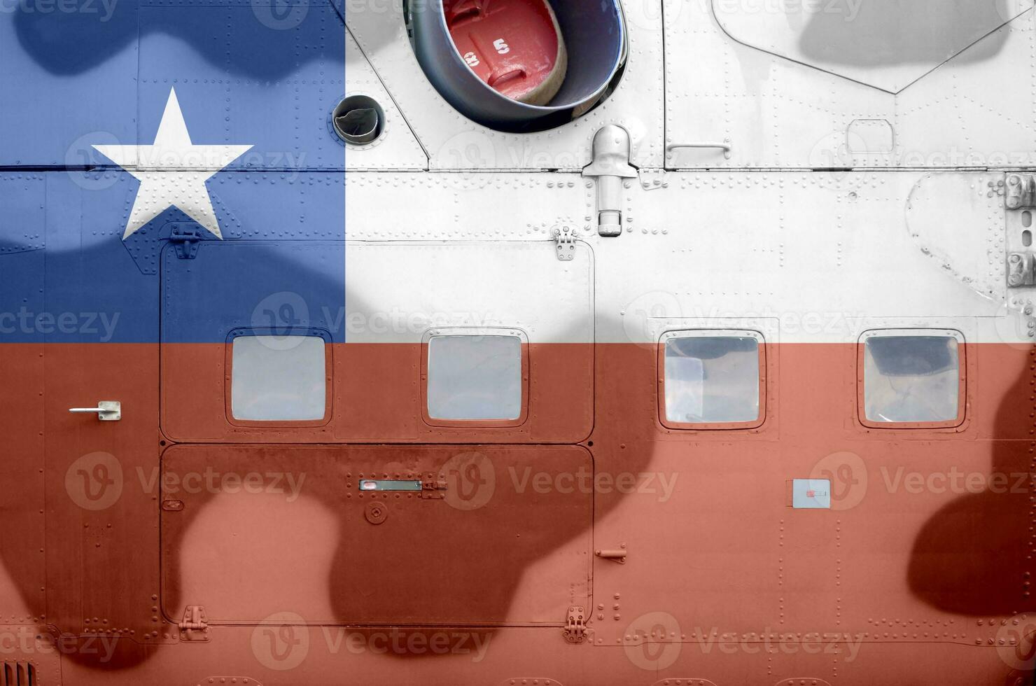 Chile flag depicted on side part of military armored helicopter closeup. Army forces aircraft conceptual background photo