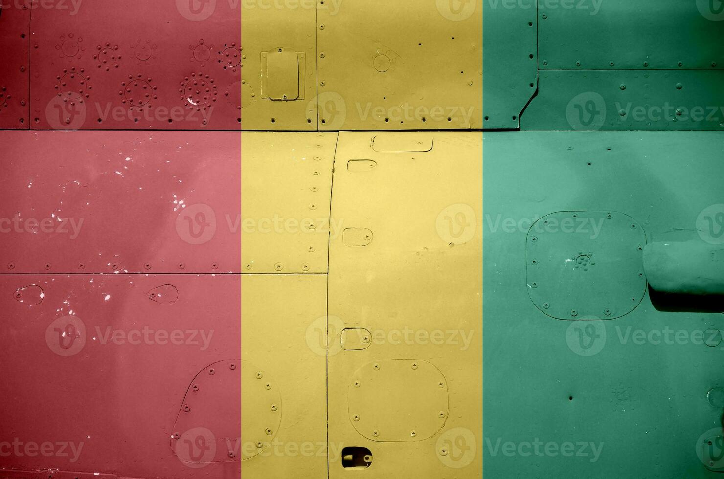 Guinea flag depicted on side part of military armored helicopter closeup. Army forces aircraft conceptual background photo