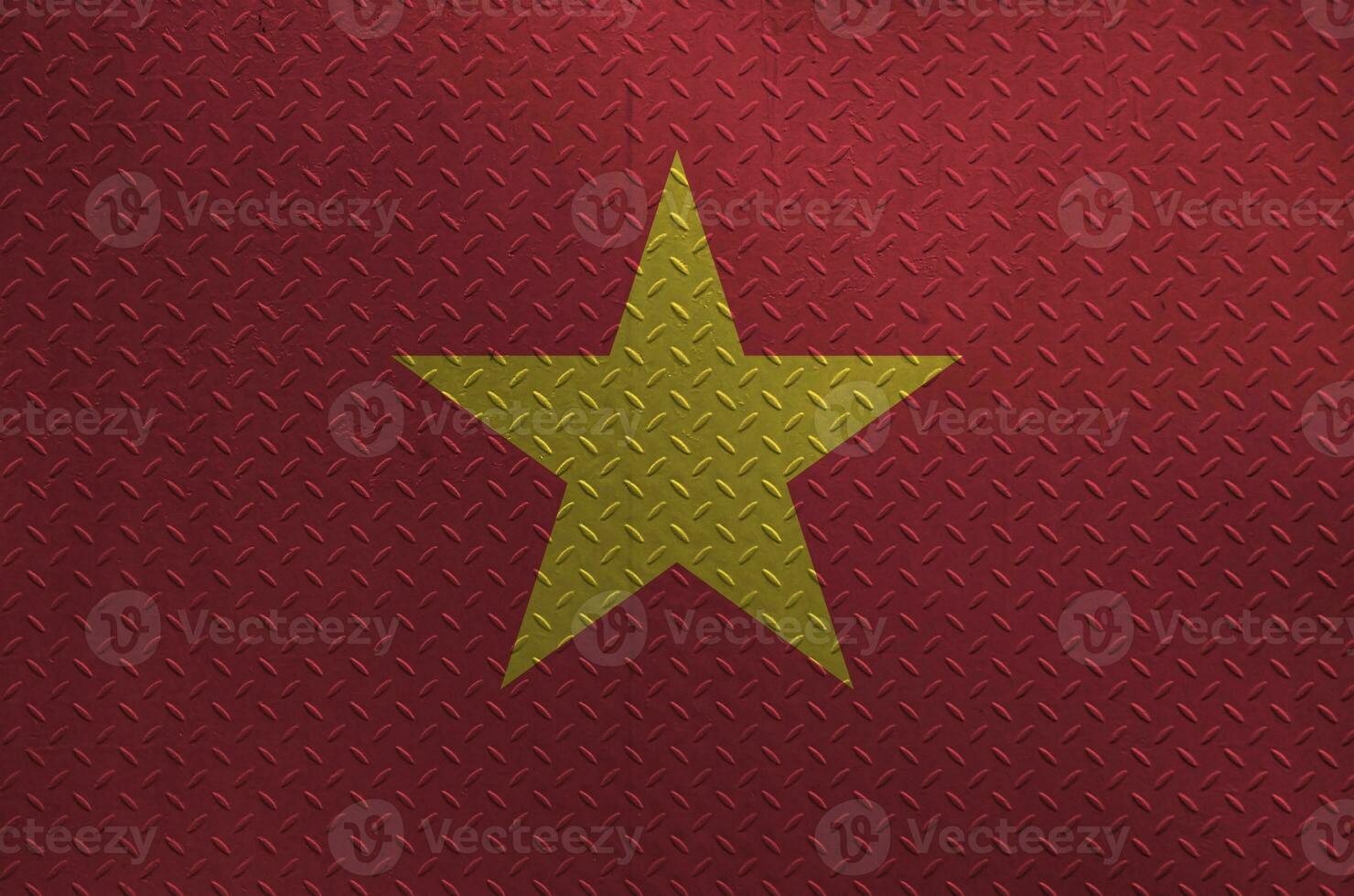 Vietnam flag depicted in paint colors on old brushed metal plate or wall closeup. Textured banner on rough background photo