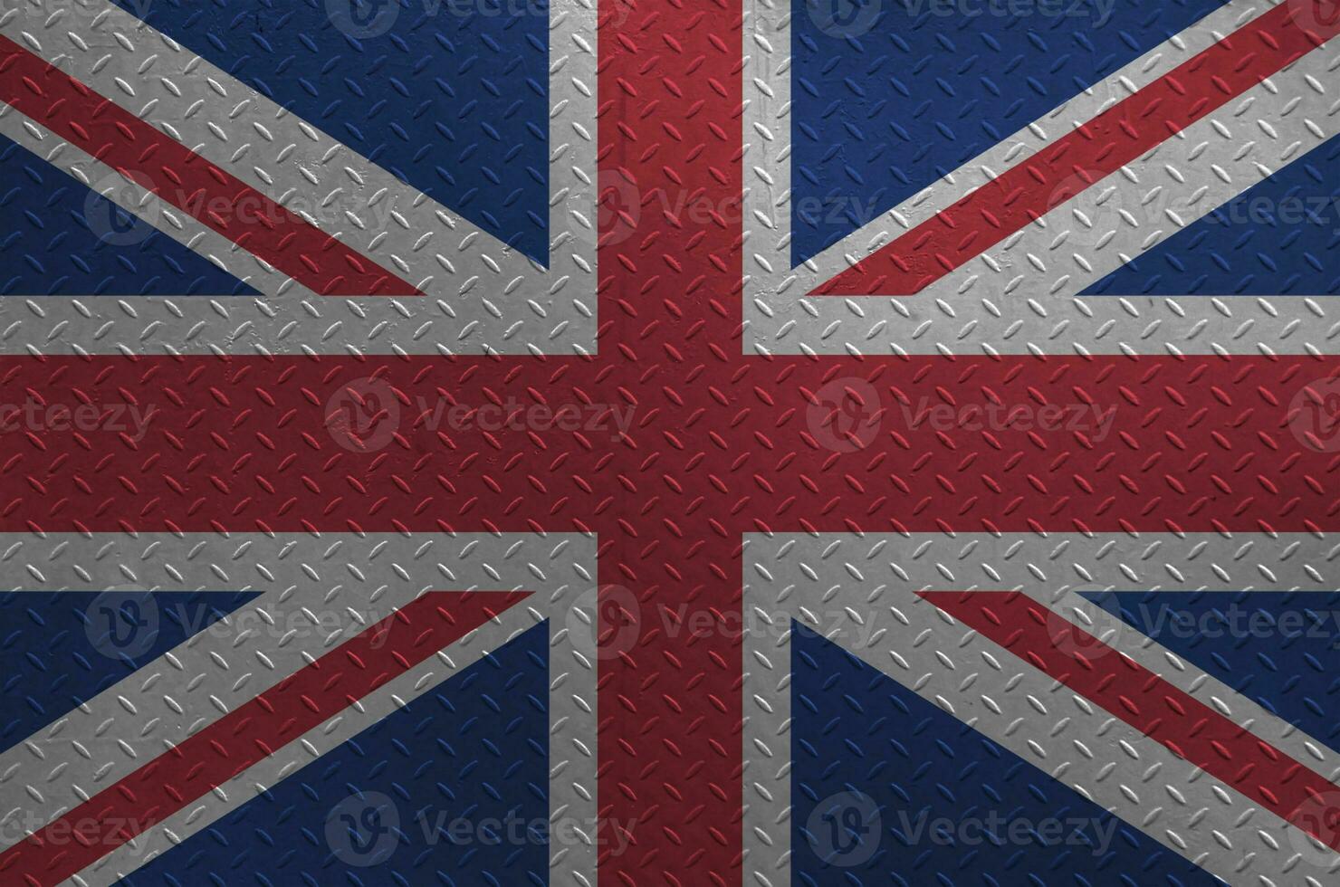 Great britain flag depicted in paint colors on old brushed metal plate or wall closeup. Textured banner on rough background photo