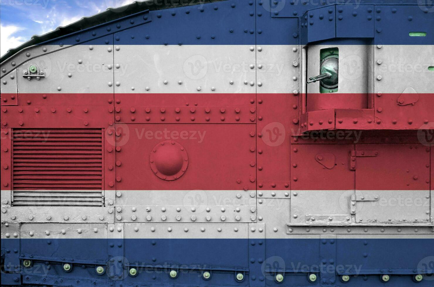 Costa Rica flag depicted on side part of military armored tank closeup. Army forces conceptual background photo