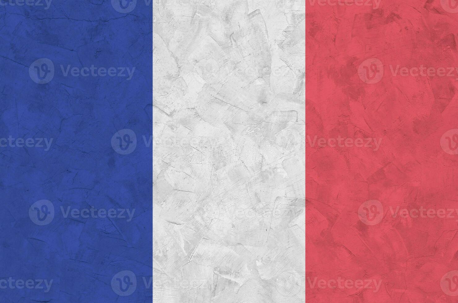 France flag depicted in bright paint colors on old relief plastering wall. Textured banner on rough background photo
