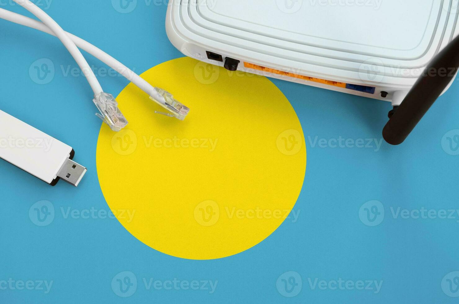 Palau flag depicted on table with internet rj45 cable, wireless usb wifi adapter and router. Internet connection concept photo