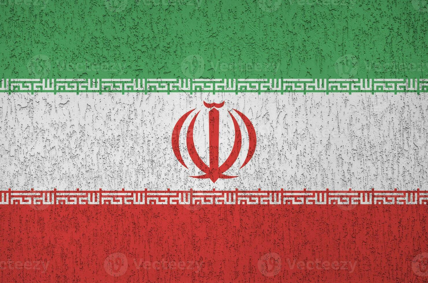 Iran flag depicted in bright paint colors on old relief plastering wall. Textured banner on rough background photo