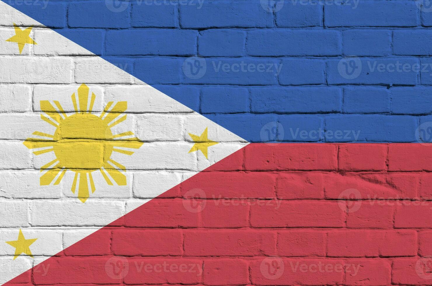 Philippines flag depicted in paint colors on old brick wall. Textured banner on big brick wall masonry background photo