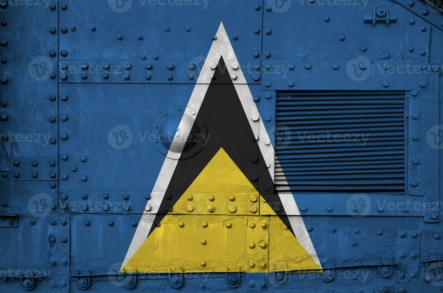 Saint Lucia flag depicted on side part of military armored tank closeup. Army forces conceptual background photo