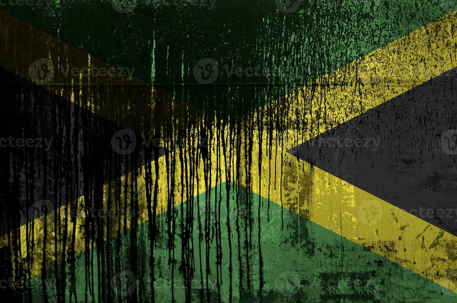 Jamaica flag depicted in paint colors on old and dirty oil barrel wall closeup. Textured banner on rough background photo