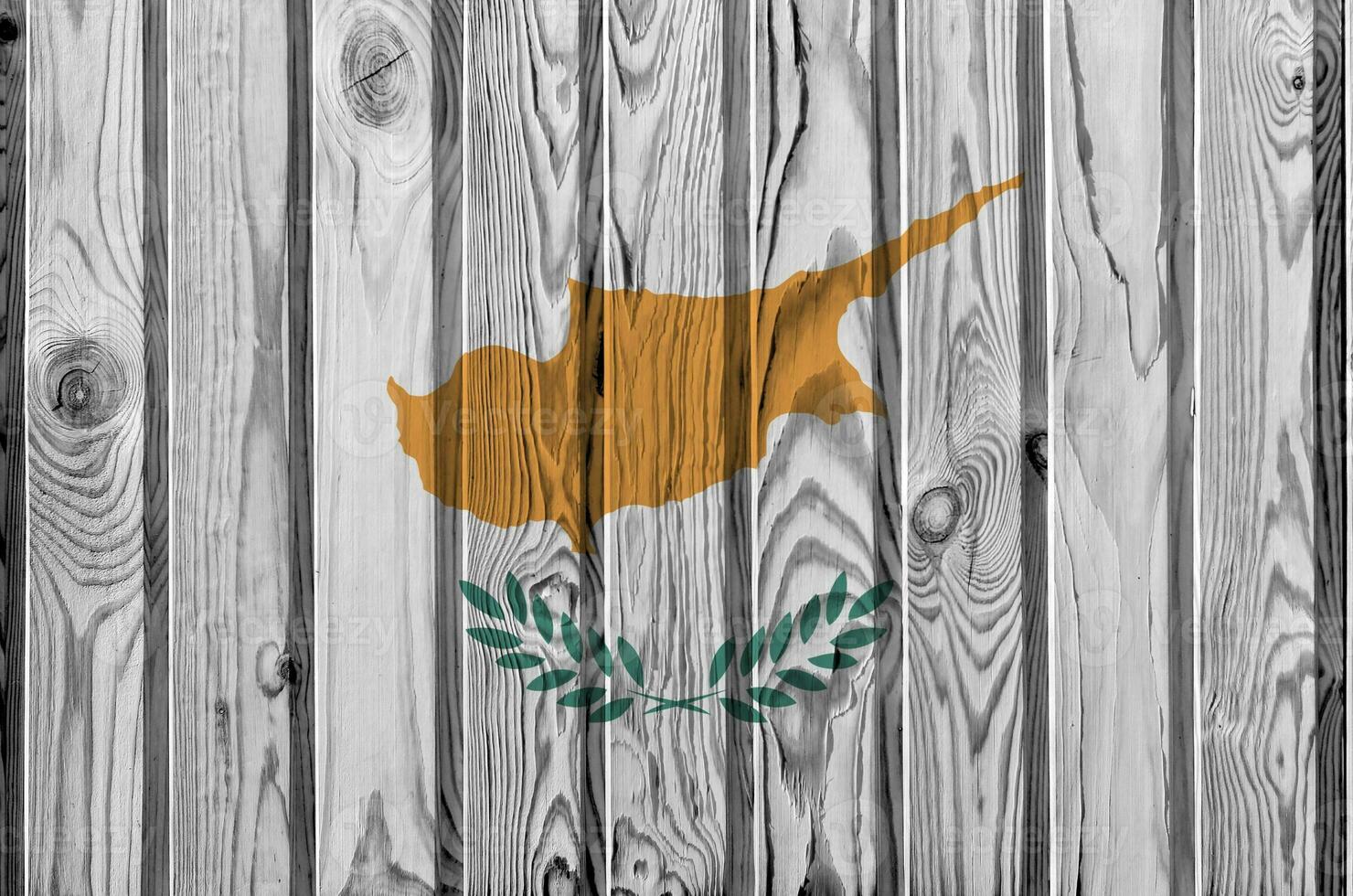 Cyprus flag depicted in bright paint colors on old wooden wall. Textured banner on rough background photo