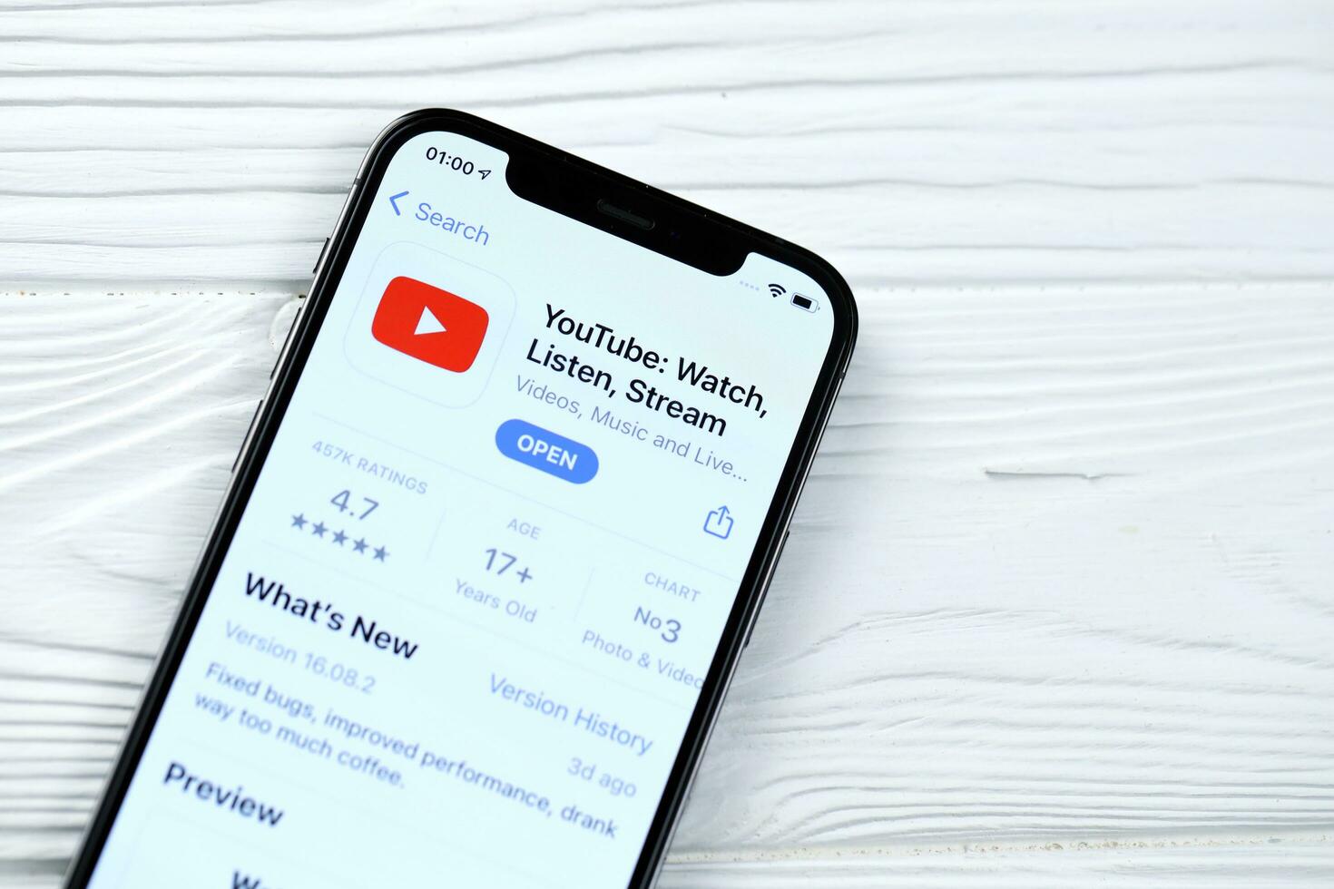 KHARKOV, UKRAINE - MARCH 5, 2021 Youtube icon and application from App store on iPhone 12 pro display screen on white table photo