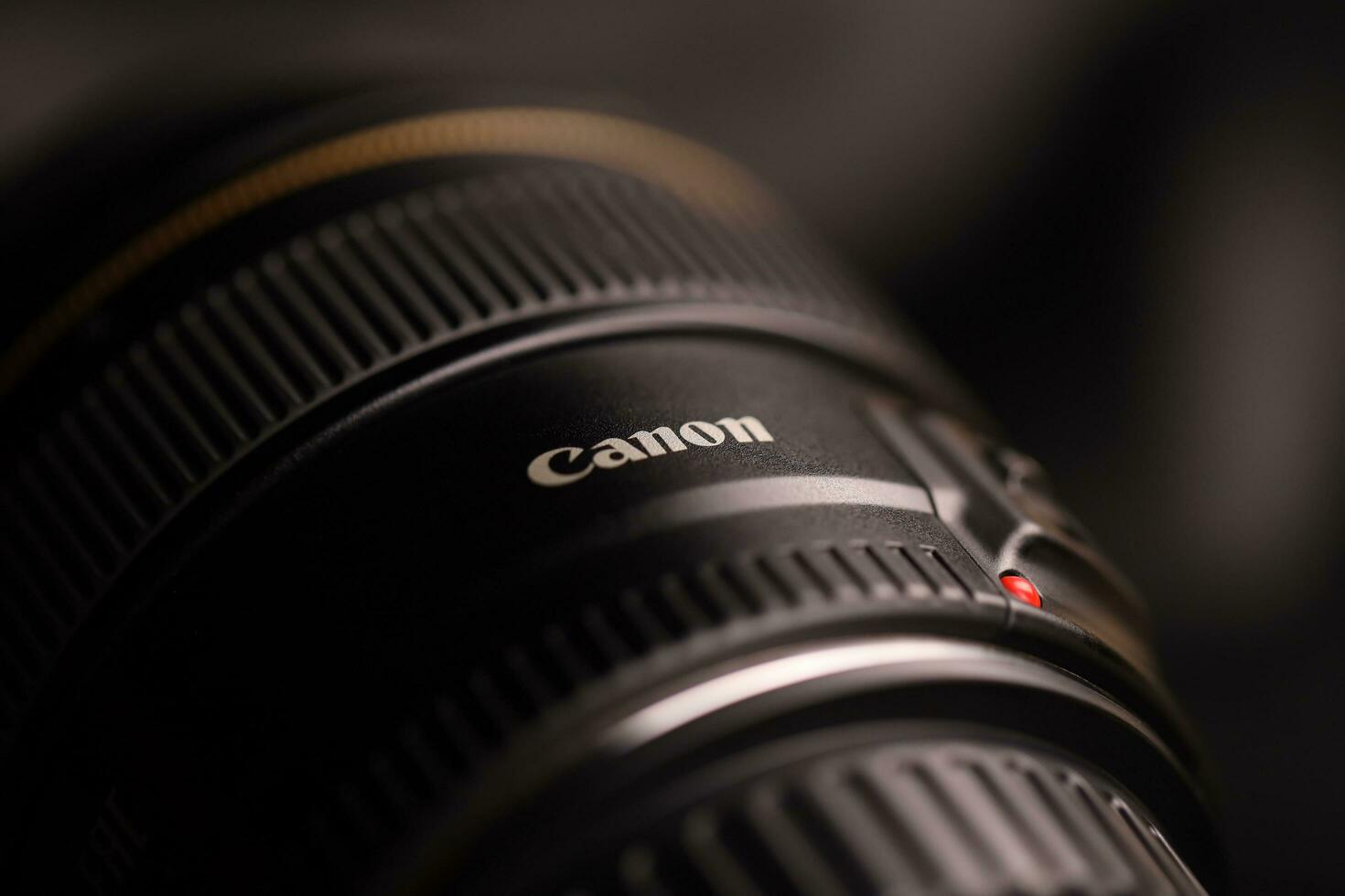 KHARKOV, UKRAINE - JANUARY 21, 2021 Canon EF 85mm 1.8 lens on fabric background. Detailed photo of Canon brand product