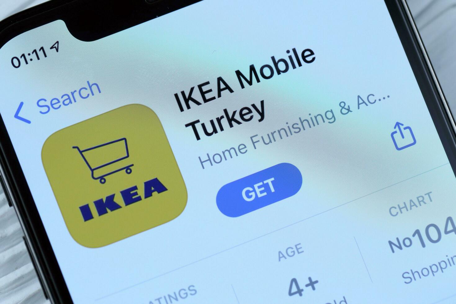 KHARKOV, UKRAINE - MARCH 5, 2021 Ikea icon and application from App store on iPhone 12 pro display screen on white table photo