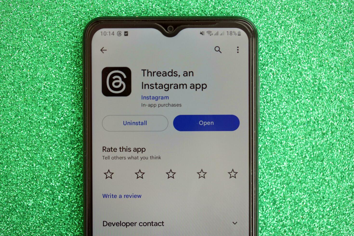 KYIV, UKRAINE - JULY 7, 2023 Threads by Meta application on display of Samsung smartphone lying on table photo
