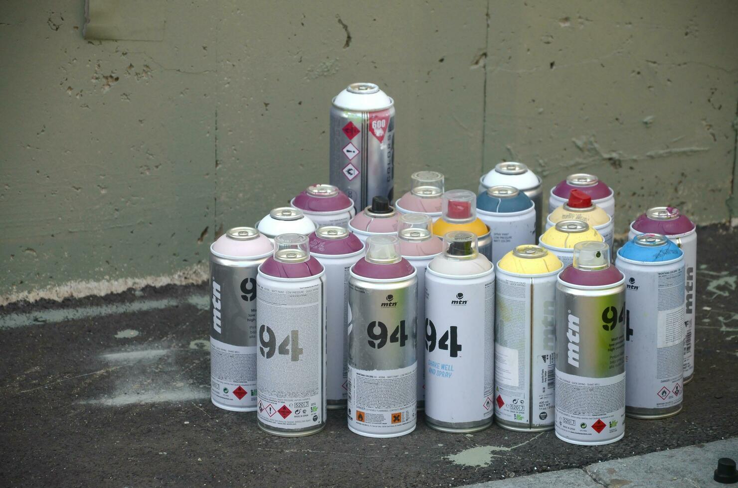 Montana mtn 94 and Kobra used spray cans for graffiti painting outdoors photo